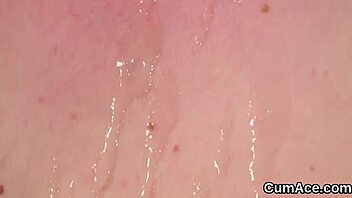 Beautiful woman gets facial with cum while giving a blow job and getting Bukkake wash