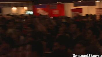 naughty brunette dancing and ripping off her clothes in striptease