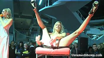 Horny slut rips her clothes and spreads legs during striptease