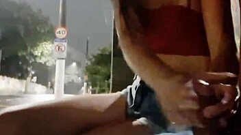 Risky handjob for a hot brunette at the bus stop.
