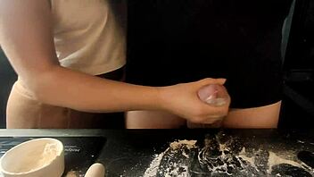 Close up of a penis being jerked off and breaded