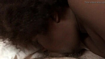 Intriguing contrast: young ebony teen takes cock while fingering herself in interracial scene.