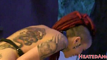 check out this goth punk in photoshoot, showing tattoos and piercings close up