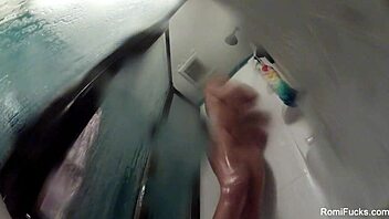 Romi Rain Showers Nude, Bathing with Big Tits and Ass, Masturbating Pussy in Solo Scene