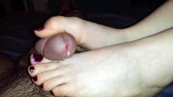 wife gives slow sensual footjob to husband at home