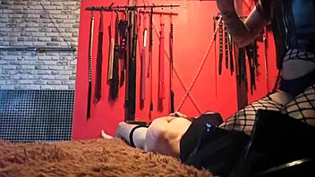 Why does Dominatrix Nike tie her slave and ride a dildo on his face?