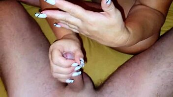 Blonde couple in bed: she sucks balls and jerks off for good behavior