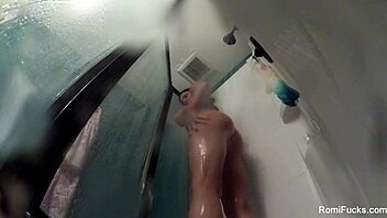 Romi Rain Showers Nude, Bathing with Big Tits and Ass, Masturbating Pussy in Solo Scene