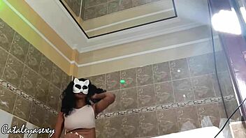 Huge tits ebony model switches costumes for the camera?