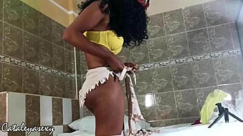 Huge tits ebony model switches costumes for the camera?