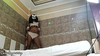 Huge tits ebony model switches costumes for the camera?