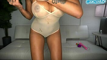 Zoey Sinn's big tits tease in sheer lingerie while masturbating with sex toys