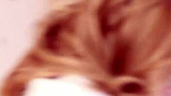 Brett Shows Off Busty Curves in Red Heels