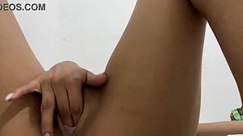 Petite teen plays with tight pussy