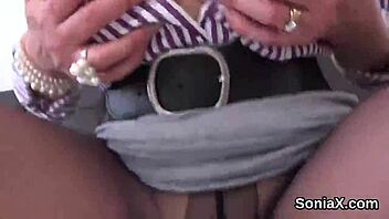 The unfaithful UK milf Lady Sonia casually spreads in lingerie to reveal her huge boobies
