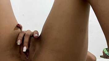 Petite teen plays with tight pussy