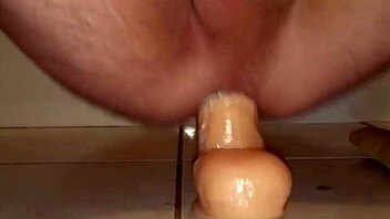 I love watching this amateur's huge dildo gaping her ass in intense fucking.