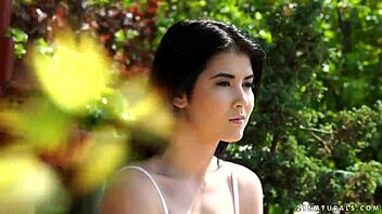 A beautiful woman with black hair has sex outside