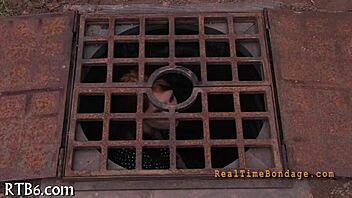 Bound and gagged for punishment in the dark room.