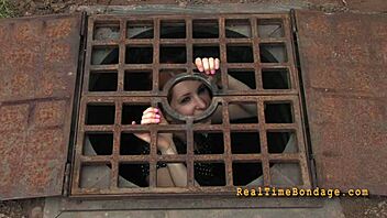 Bound and gagged for punishment in the dark room.