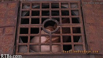 Bound and gagged for punishment in the dark room.