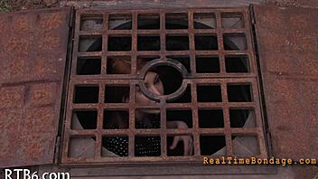 Bound and gagged for punishment in the dark room.