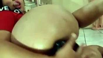 A hot and steamy Brazilian beauty gets her hole stretched by a big black dildo