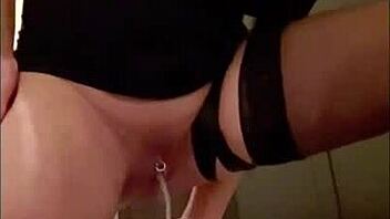 A strong stream of pee on the bed and my stockings tied up in a kinky scene with my girlfriend