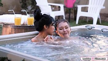 tattooed woman sits on asian friend's face in intimate moment