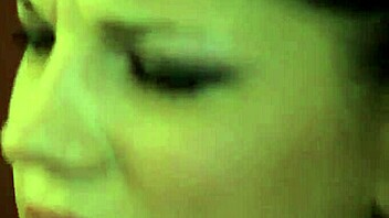 Angel Rivas smoking while using strap on