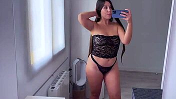 Cute amateur tries on see-through clothes, showing big ass and tits in homemade haul.
