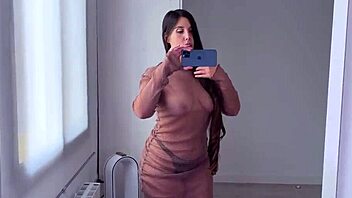 Cute amateur tries on see-through clothes, showing big ass and tits in homemade haul.