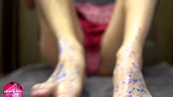 girl plays with glitters and gives footjob to big dildo
