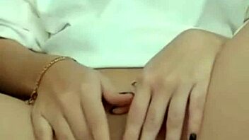 Hot brunette on webcam teases by showing her pussy during masturbation