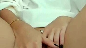 Hot brunette on webcam teases by showing her pussy during masturbation