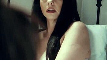 Milf and young lesbian babe in garage with strapon.