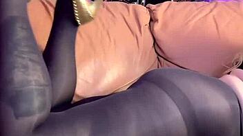 i'm masturbating in my black pantyhose, feeling the nylon on my hairy beaver