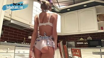 Lovely camgirl masturbates with dildo in kitchen