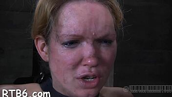 cutie endures harsh caning in tight restraint scene