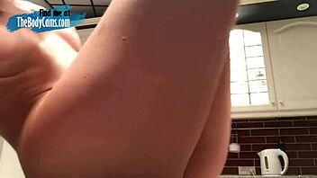 Lovely camgirl masturbates with dildo in kitchen