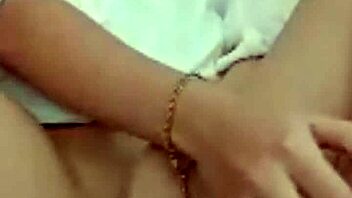 Hot brunette on webcam teases by showing her pussy during masturbation