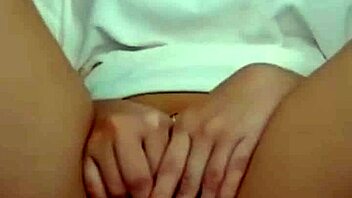 Hot brunette on webcam teases by showing her pussy during masturbation