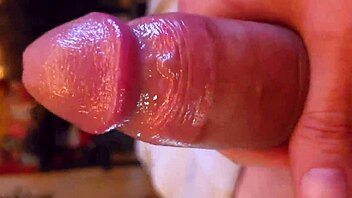 i'm playing with my shaved oiled cock in homemade solo