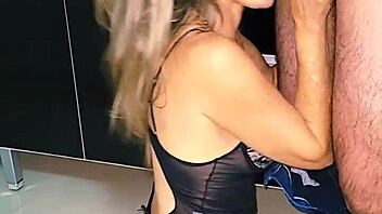 blonde wife cleans up in the kitchen sink