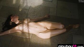 Petite brunette Ivy Rose undresses in the sauna