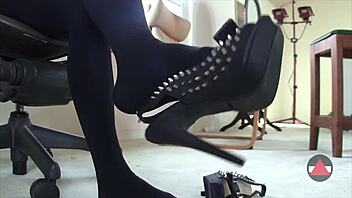 sexy babe dangles shoes in pantyhose close up