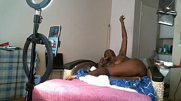 Solo sexy african american milf naked with saggy tits.