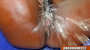 Ebony babe takes on huge cock with wild fingering and squirting action. She can’t hold back!