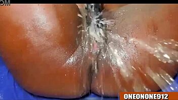 Ebony babe takes on huge cock with wild fingering and squirting action. She can’t hold back!