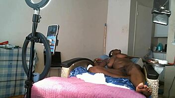 Solo sexy african american milf naked with saggy tits.